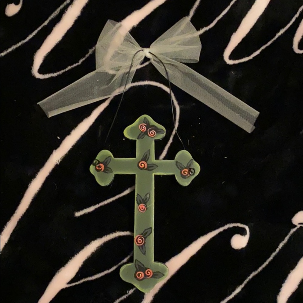 Cross with hook attached